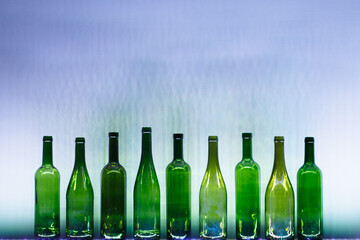 abstract empty wine bottles with blue led illumination