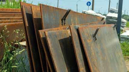 rusty iron sheets stacked on top of each other