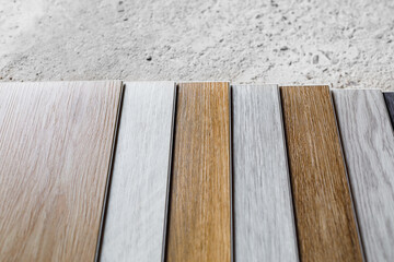 laminate flooring planks variations on concrete floor