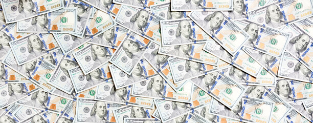 Top view of one hundred dollar banknotes made as a background. USD currency concept. Texture of American dollars