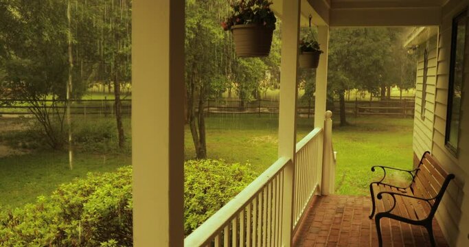 Rural porch in the evening with heavy rain falling