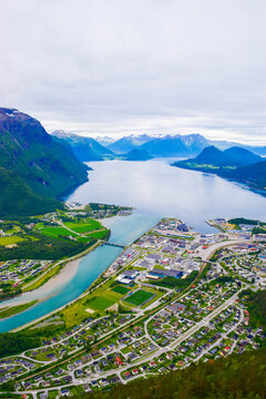 Scenic landscape Andalsnes city located on shores of Romsdal Fjord between the picturesque mountains. View from Rampestreken Viewpoint, Andalsnes, Norway.