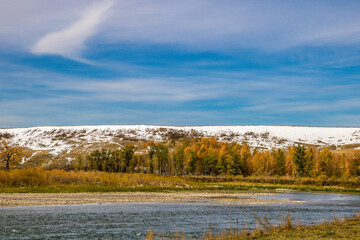 Early fall snow on the foothills and Bow River. Wyndham and Carsland Provincial Park. Alberta, Canada