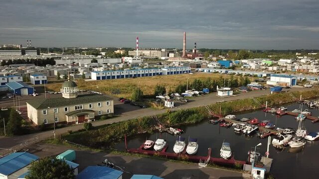4K summer late afternoon aerial video of Baltic Sea Finnish Bay lagoon, Saint Petersburg boat parking yacht club area, boats and calm water surface in the northern capital of Russia