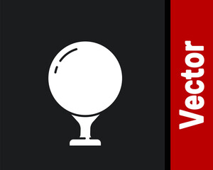 White Golf ball on tee icon isolated on black background. Vector Illustration.