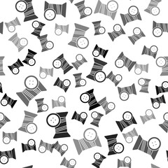 Black Sewing thread on spool and button icon isolated seamless pattern on white background. Yarn spool. Thread bobbin. Vector Illustration.