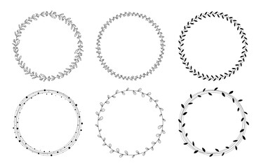 Hand drawn floral wreath and leaves. Decorative elements for design with Ink, vintage and doodle styles.