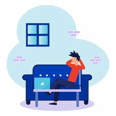 The young man sat at a desk with a laptop and worked online at a picture house. Social distance and self-isolation during the corona virus quarantine.