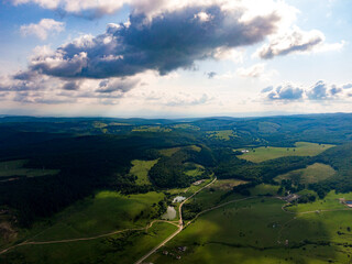 Obraz premium Aerial photos of a field plus some beautiful clouds