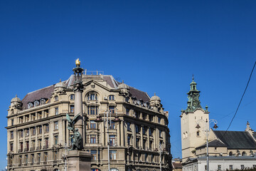 Fototapeta premium Adam Mickiewicz Monument in Lviv, Ukraine. Lviv is a city in western Ukraine - Capital of historical region of Galicia. Lviv historic city center is on the UNESCO World Heritage List.