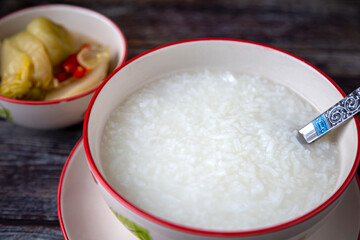 
Porridge in a bowl and pickled cabbage for breakfast