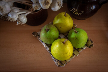 four pears on a plate