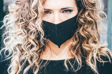 Girl in the protection mask hip hop style. Urban street fashion.