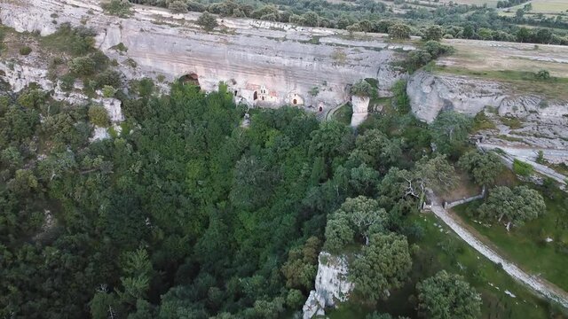Aerial view of Saint Bernabe Ancient Heremitage in a cave in Ojo Guarena, Burgos, Spain. High quality 4k footage