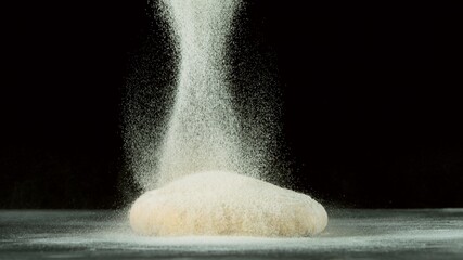 Freeze motion of pouring flour on yeast dough