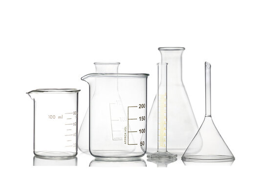 Set of laboratory glassware filled by colorless isolated on white background.