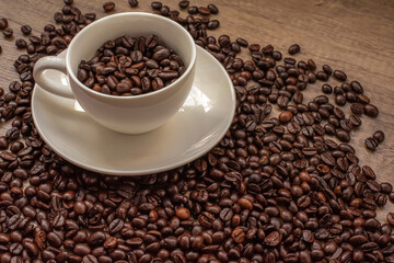 roasted coffee beans, mugs,wood background