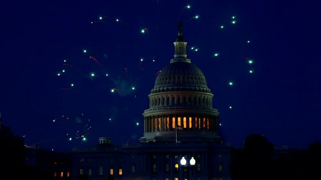 July 4th Independence day show cheerful fireworks display on the US Capitol Building in Washington DC USA