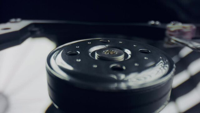 Computer hard drive disk. Dolly shot of disassembled hard drive from computer