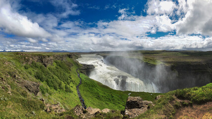 Panoramic view of Gullfoss waterfall on the Hvítá river, a popular tourist attraction and part of the Golden Circle Tourist Route in Southwest Iceland. Golden Waterfall.