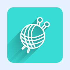 White line Yarn ball with knitting needles icon isolated with long shadow. Label for hand made, knitting or tailor shop. Green square button. Vector Illustration.