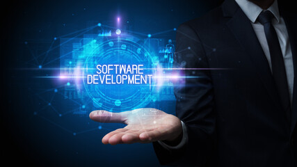 Man hand holding SOFTWARE DEVELOPMENT inscription, technology concept