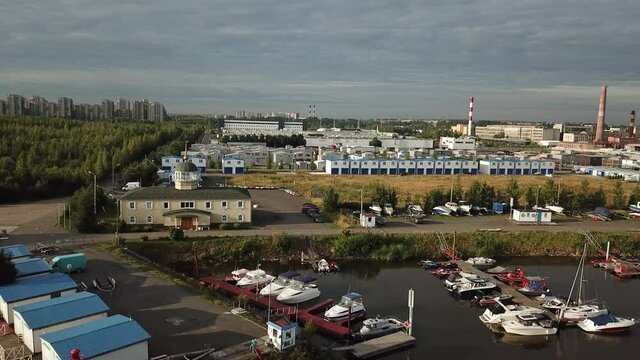 4K summer late afternoon aerial video of Baltic Sea Finnish Bay lagoon, Saint Petersburg boat parking yacht club area, boats and calm water surface in the northern capital of Russia