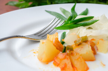 Potatoes with greens on a plate. A diet dish.