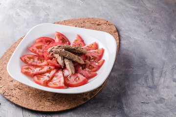 Seasoned tomato with melva ready to eat. Spanish restaurant dish