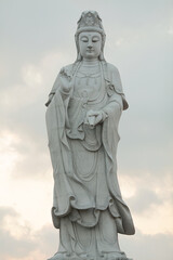 Fototapeta na wymiar Dewi Kwan Im statue on the sky