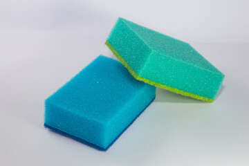 Sponge. Blue and green sponge. Sponge on a white background.