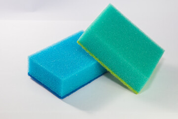 Sponge. Blue and green sponge. Sponge on a white background.