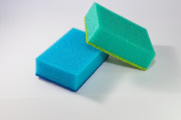 Sponge. Blue and green sponge. Sponge on a white background.