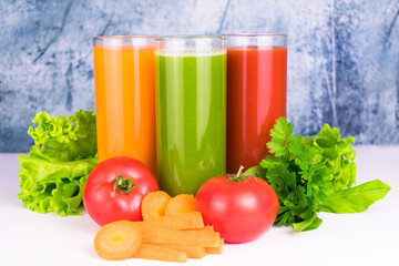 
Three glasses with fresh vegetable juices. Close-up.