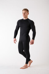 The guy in thermal underwear on a white background. Sportswear.