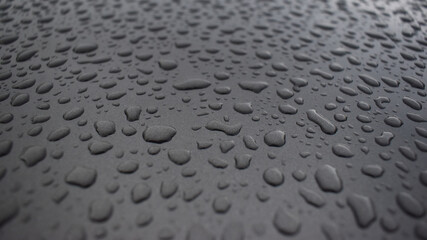 close up Raindrops stuck on cars texture.