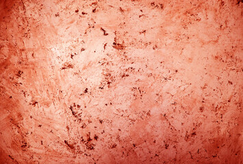 Red lightly textured concrete wall.