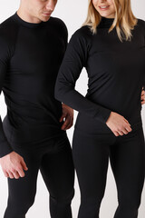 Guy and girl in thermal underwear on a white background