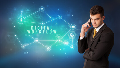 Businessman in front of cloud service icons with DIGITAL WORKFLOW inscription, modern technology concept