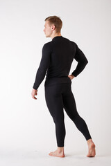 The guy in thermal underwear on a white background. Sportswear.