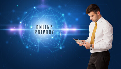 Businessman thinking about security solutions with ONLINE PRIVACY inscription