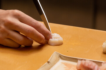 Making raw white fish sashimi with chef's face, Japanese food