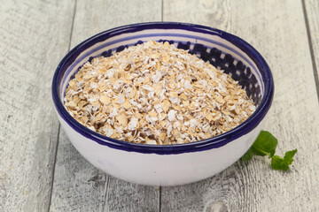 Raw oats in the bowl