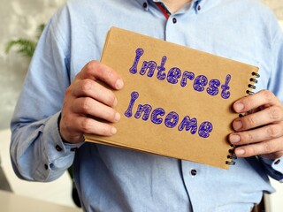 Interest Income sign on the piece of paper.