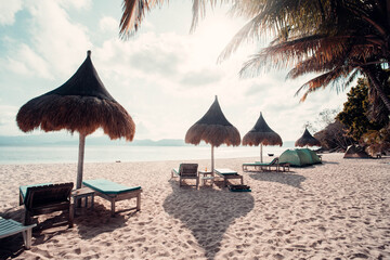 beach chairs and umbrellas on the beach