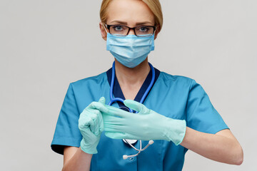 medical doctor nurse woman with stethoscope wearing protective mask and rubber or latex gloves