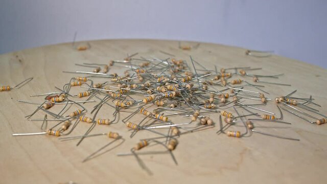close up group of electronic resistor components on a white background