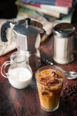 iced coffe with milk and book cafe background