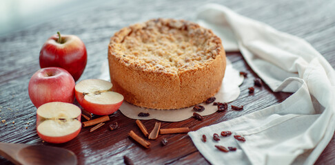 Homemade delicious apple pie with different ingredients on rustic background. Classic autumn Thanksgiving dessert - organic apple pie.