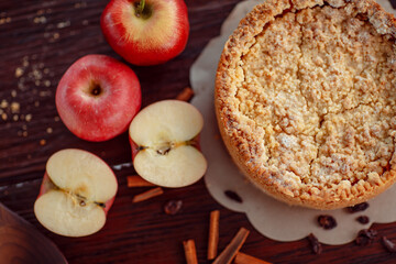 Homemade delicious apple pie with different ingredients on rustic background. Classic autumn Thanksgiving dessert - organic apple pie.